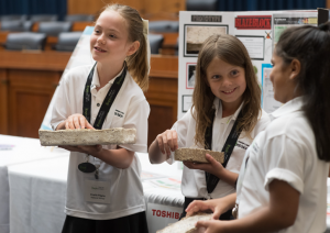 Sofia Taha, Kason Sonnenberg-Trent, and Charlie Pilgrim, Coach Melina Powell, and Mentor Rabia Taha from Don Campbell Elementary School in Alberta, Canada.